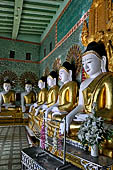 Myanmar - Sagaing, Umin Thounzeh (the 30 Caves), a colourful crescent-shaped colonnade within which there are 45 Buddha images. 